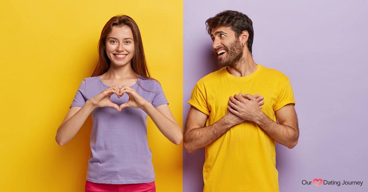 A woman and man showing a heart gesture