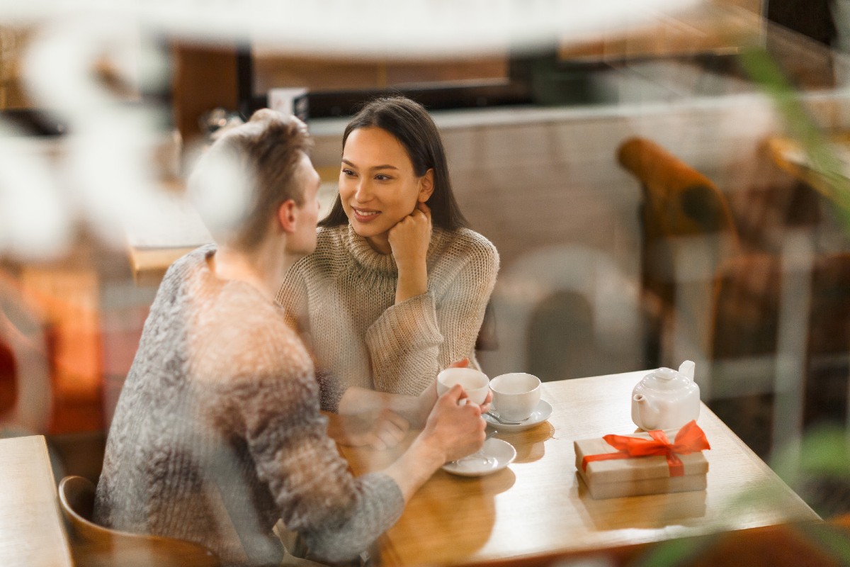 A man talking to a woman on a date A man talking to a woman on a date