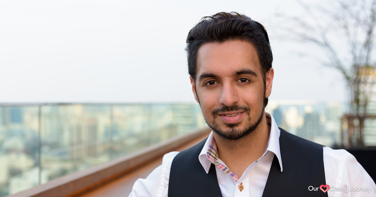 Young happy Indian man smiling at rooftop Young happy Indian man smiling at rooftop